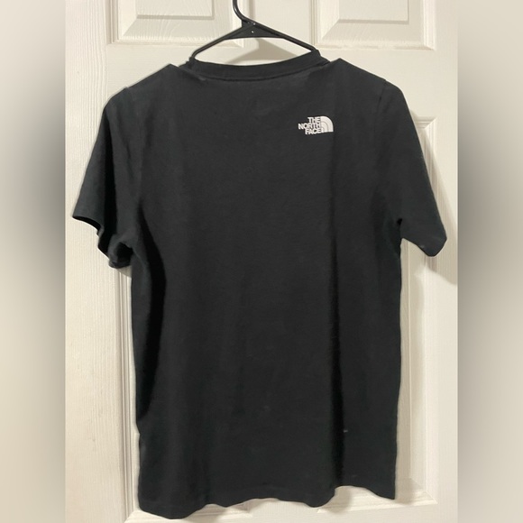 Just a black Northface shirt with the mountain in the front. - Picture 3 of 3